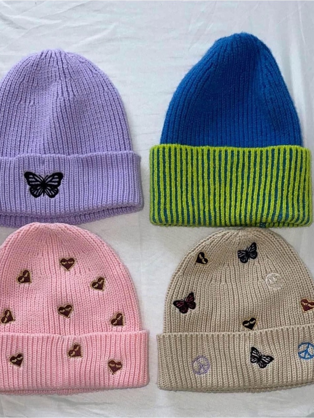 Set 4 Women’s beanies. NEVER USED.